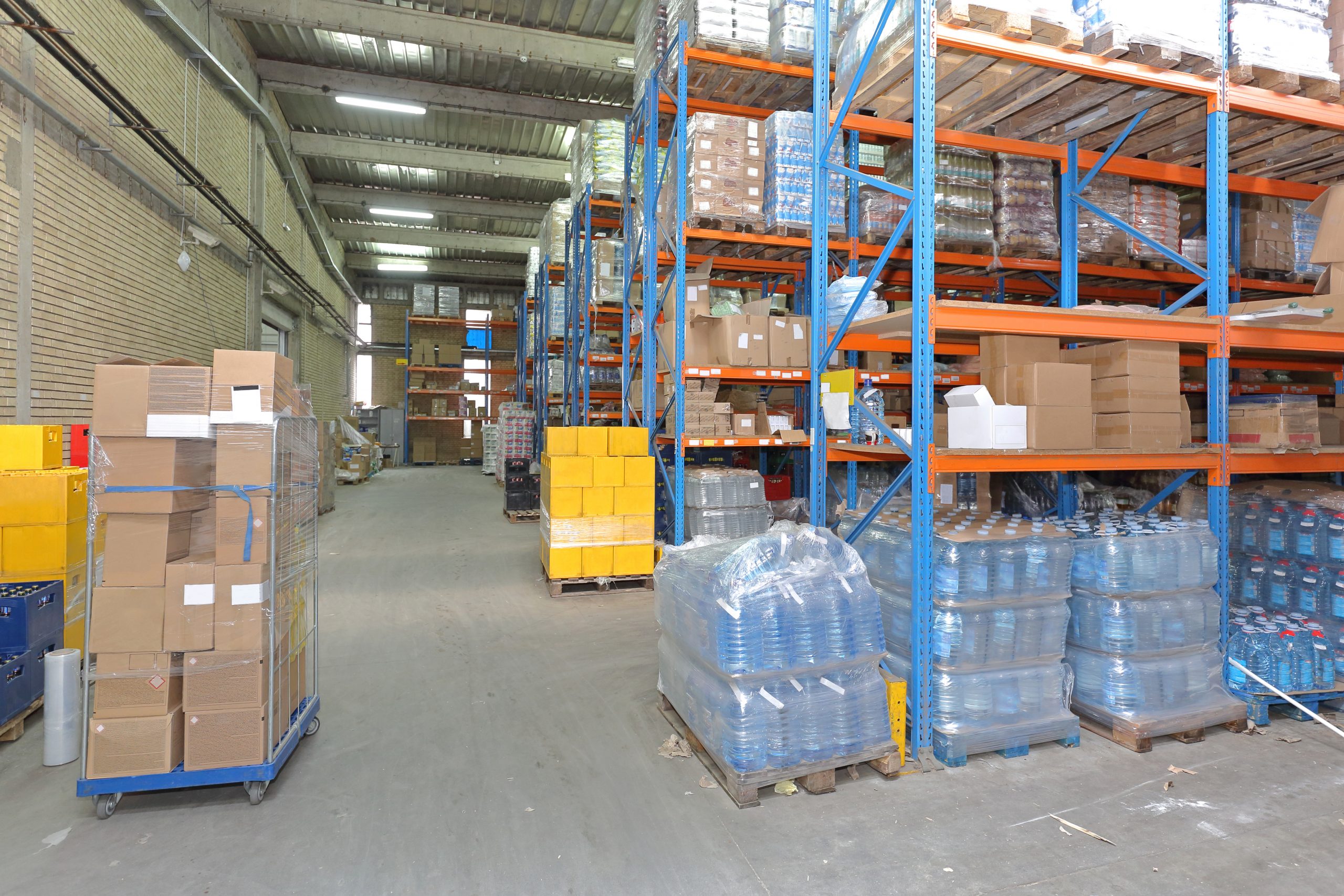 Shelves With Food and Drinks in Distribution Warehouse