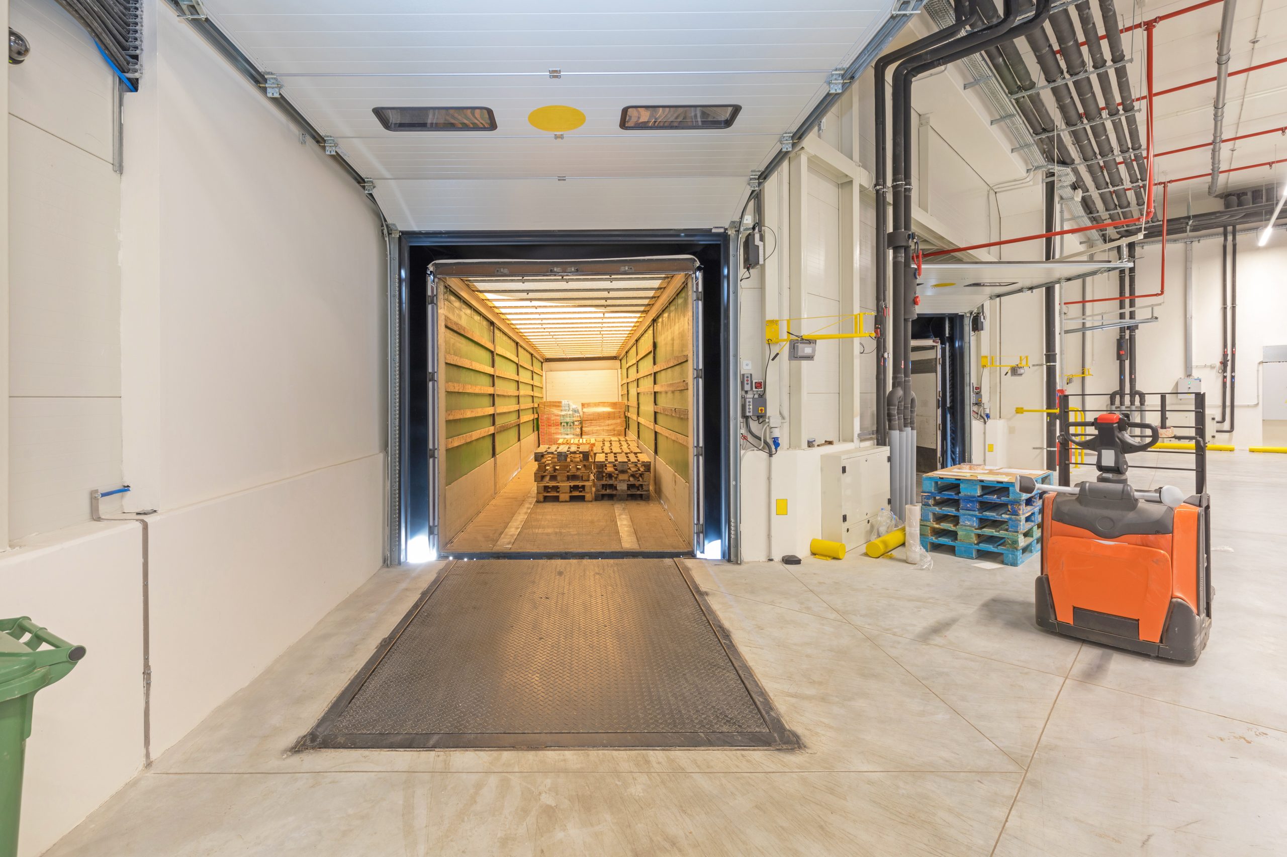 Truck Trailer at Loading Dock Pallet Jack Warehouse